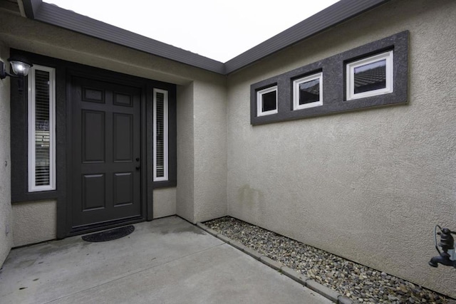 doorway to property with a patio