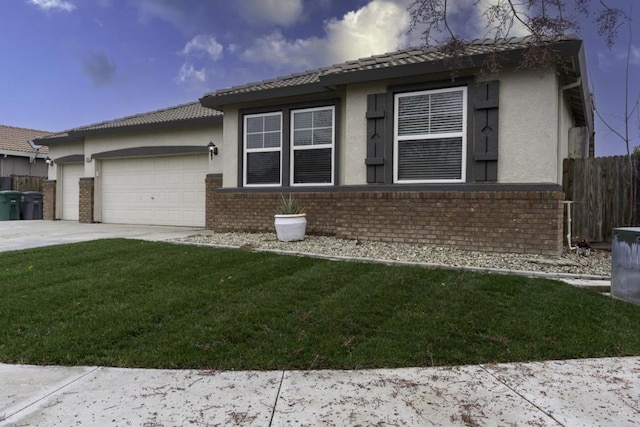 view of front of home with a front yard and a garage