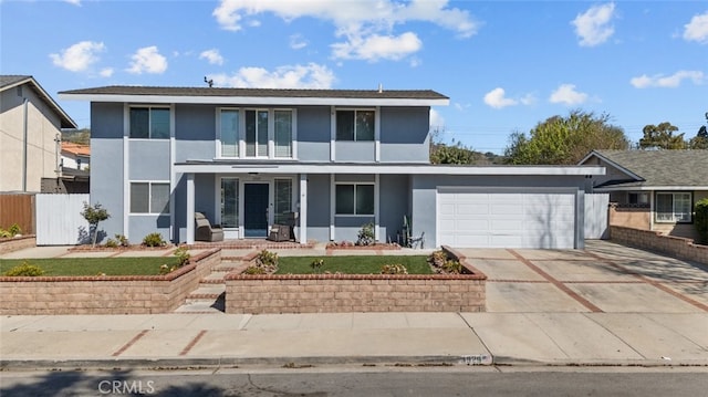 front of property featuring a garage and a porch