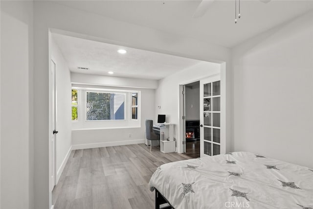 bedroom with light wood-type flooring