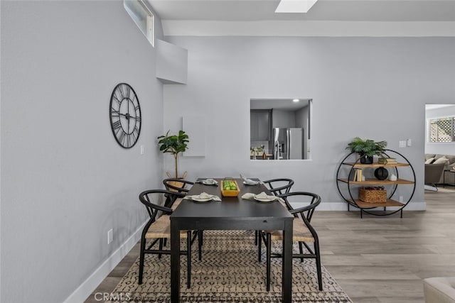 dining area with hardwood / wood-style flooring