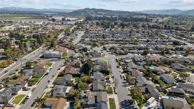 birds eye view of property featuring a mountain view