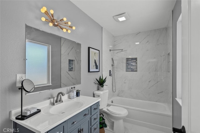 full bathroom with tiled shower / bath combo, vanity, and toilet