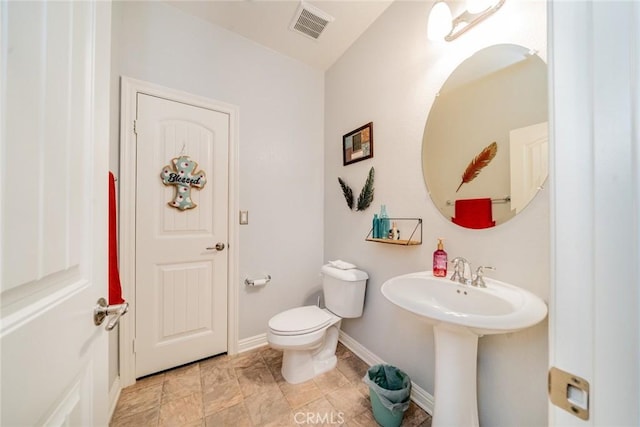 bathroom with toilet and sink