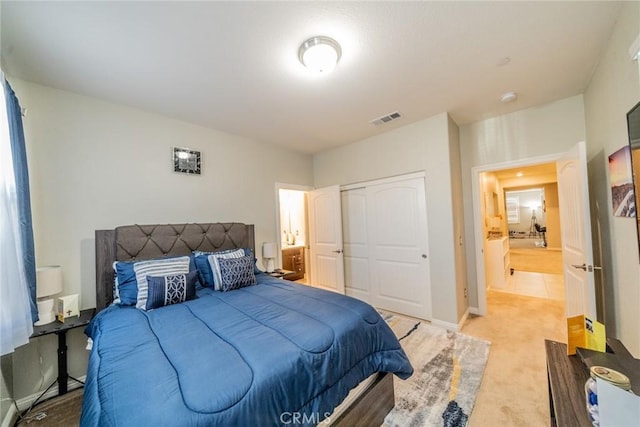 carpeted bedroom with a closet