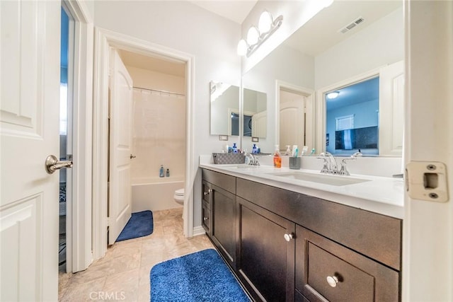 full bathroom with tile patterned floors, toilet, vanity, and shower / bathtub combination with curtain