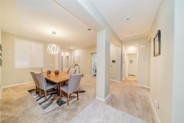 view of carpeted dining space