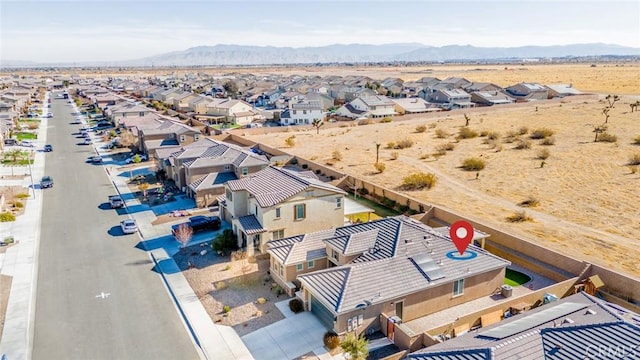 birds eye view of property featuring a mountain view