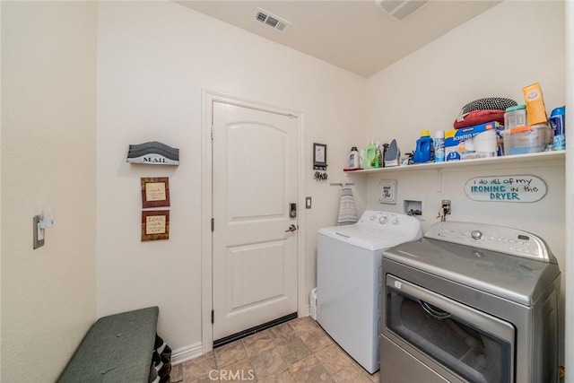 laundry area with washer and clothes dryer