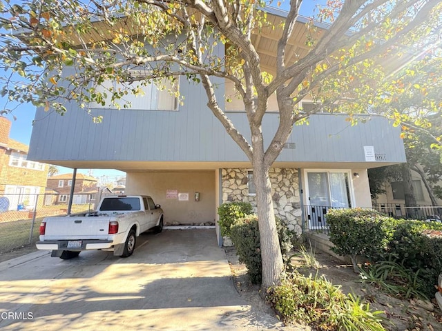 view of front of property with a carport