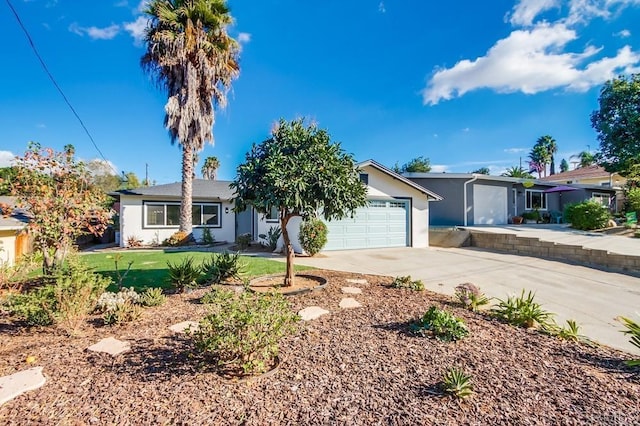 single story home featuring a front lawn and a garage