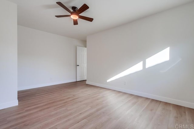 spare room with light hardwood / wood-style floors and ceiling fan