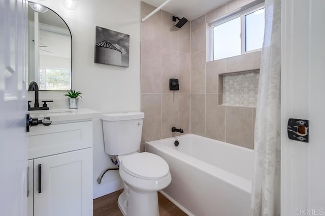 full bathroom with toilet, vanity, shower / bath combination with curtain, and hardwood / wood-style floors