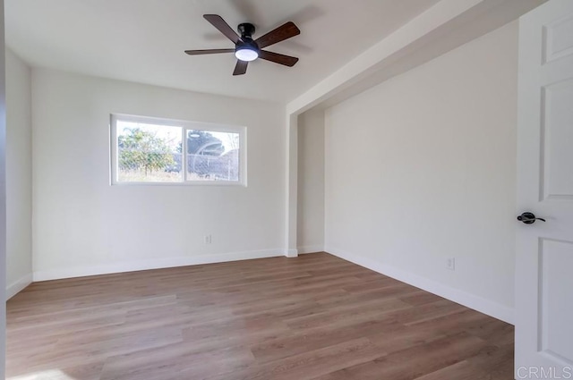 unfurnished room with ceiling fan and wood-type flooring