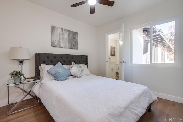 bedroom with ceiling fan, ensuite bathroom, and hardwood / wood-style floors