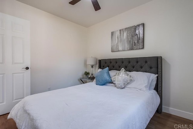 bedroom featuring ceiling fan and dark hardwood / wood-style floors