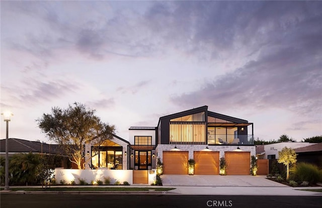 view of front of house featuring a balcony