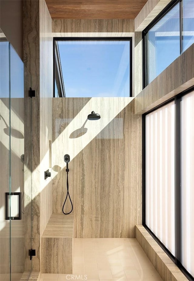 bathroom featuring wooden ceiling and walk in shower