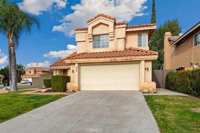 mediterranean / spanish-style house with a front lawn and a garage