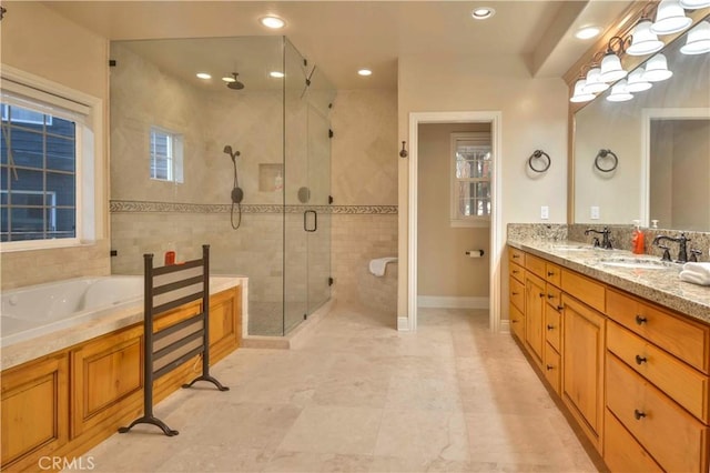 173 Grizzly Rd, Lake Arrowhead, CA 92352 - bathroom featuring a shower stall, double vanity, a bath, and recessed lighting