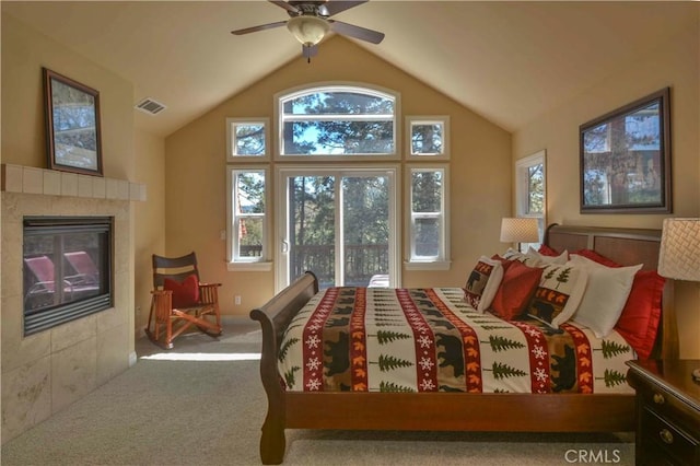 173 Grizzly Rd, Lake Arrowhead, CA 92352 - bedroom with multiple windows, carpet flooring, lofted ceiling, a tile fireplace, and ceiling fan