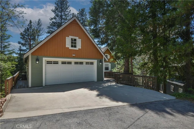 173 Grizzly Rd, Lake Arrowhead, CA 92352 - view of home's exterior with an outdoor structure, a garage, and concrete driveway