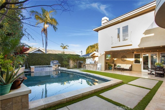 view of swimming pool with area for grilling, a patio area, an in ground hot tub, ceiling fan, and an outdoor hangout area