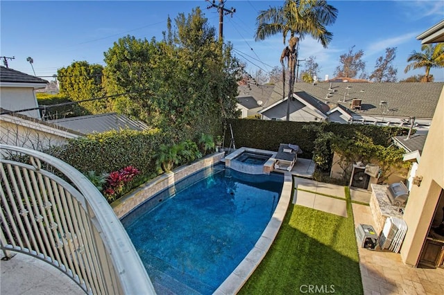 view of pool featuring an in ground hot tub and a patio