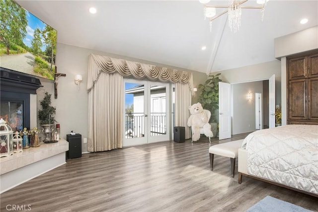 bedroom featuring hardwood / wood-style floors, access to outside, french doors, and vaulted ceiling with beams