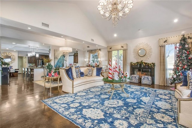 living room with high vaulted ceiling, plenty of natural light, and a notable chandelier