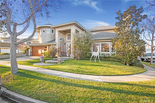 view of front facade featuring a garage and a front yard