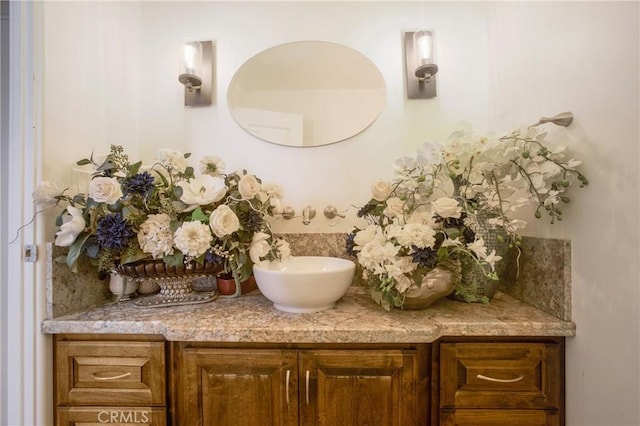 bathroom with tasteful backsplash and vanity