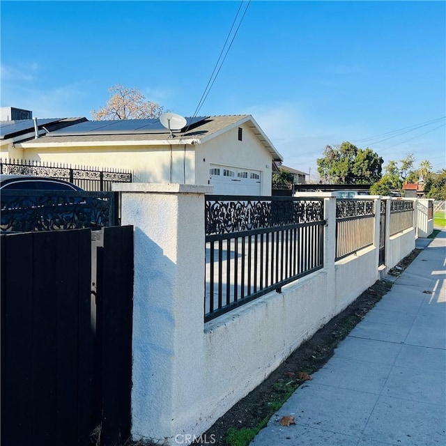 view of side of property featuring a garage