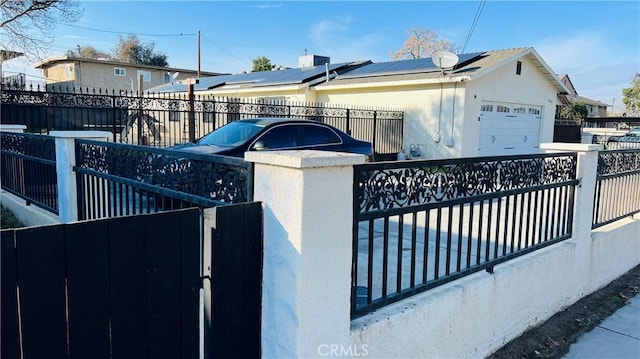 view of gate featuring a garage