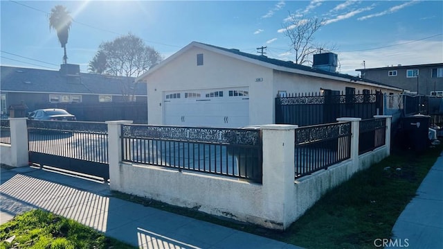 view of side of property with a garage