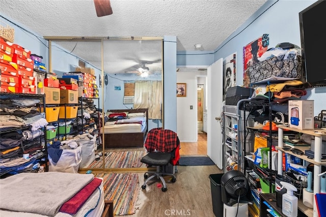 office area featuring a textured ceiling, ceiling fan, and hardwood / wood-style floors