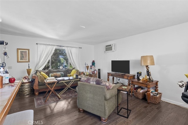 living room with dark hardwood / wood-style floors and a wall unit AC