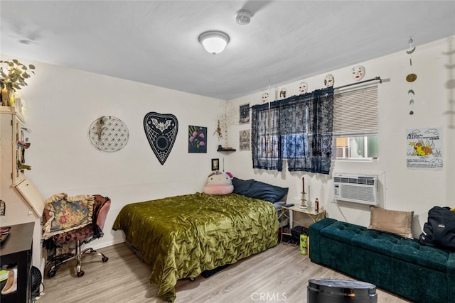 bedroom featuring hardwood / wood-style flooring and cooling unit