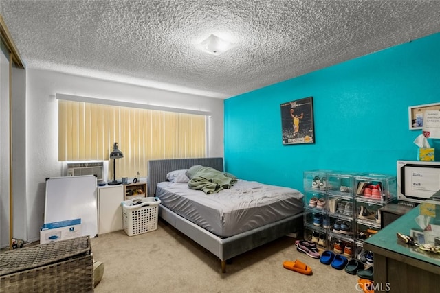 carpeted bedroom with a textured ceiling