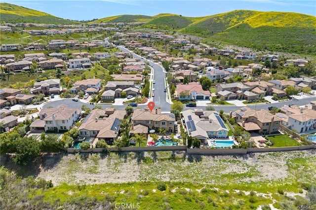 birds eye view of property with a mountain view