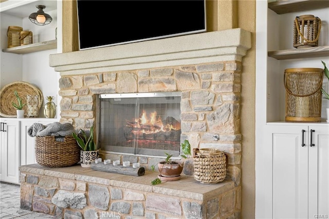 details with a stone fireplace