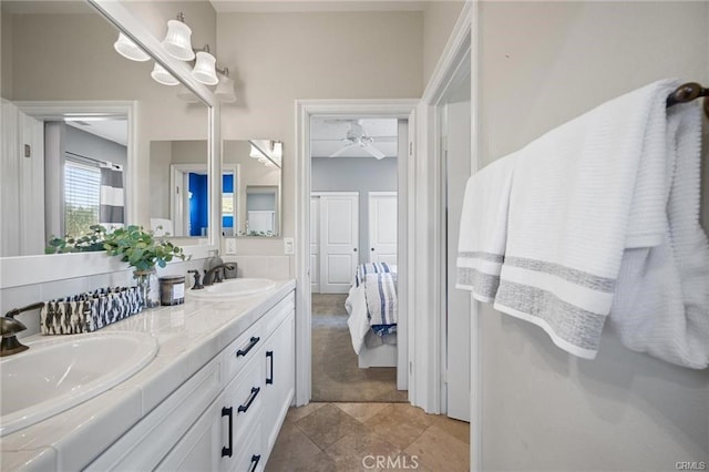 bathroom featuring ceiling fan and vanity