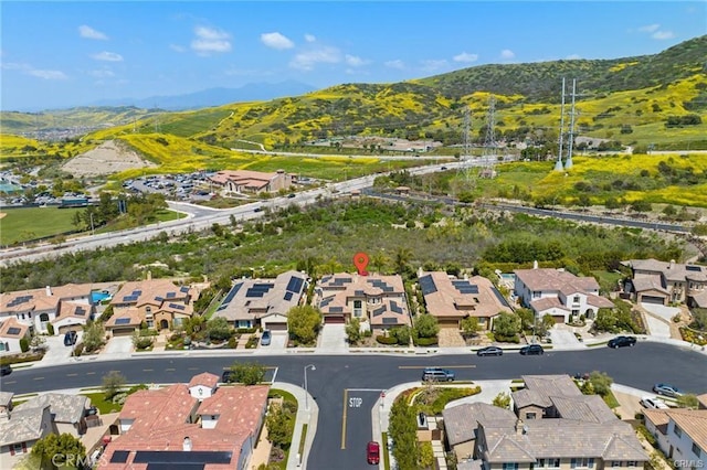 birds eye view of property with a mountain view