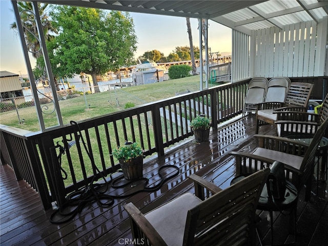 deck at dusk with a yard