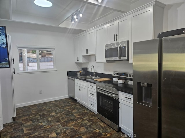 kitchen featuring white cabinets, sink, and stainless steel appliances