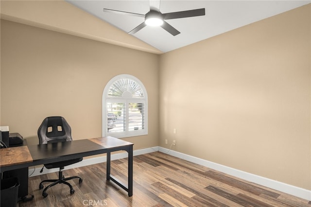 office space featuring ceiling fan, baseboards, vaulted ceiling, and wood finished floors