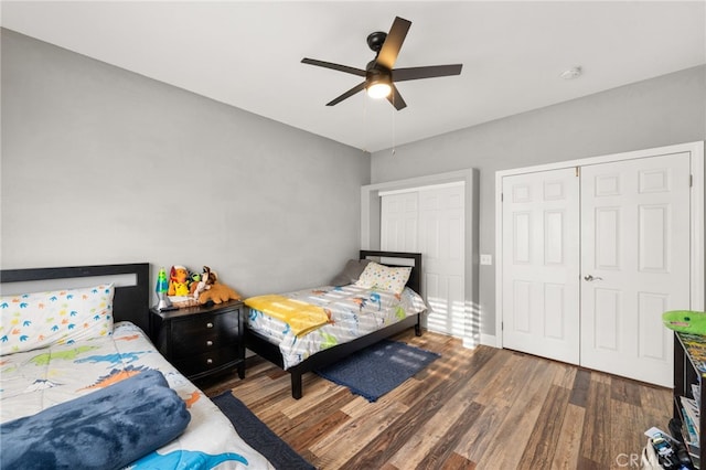 bedroom with ceiling fan and wood finished floors