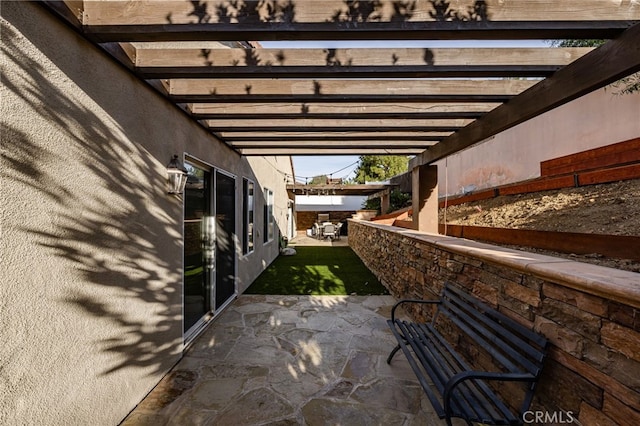 view of patio featuring a pergola