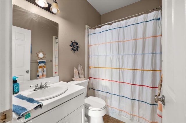 bathroom featuring a shower with curtain, vanity, and toilet