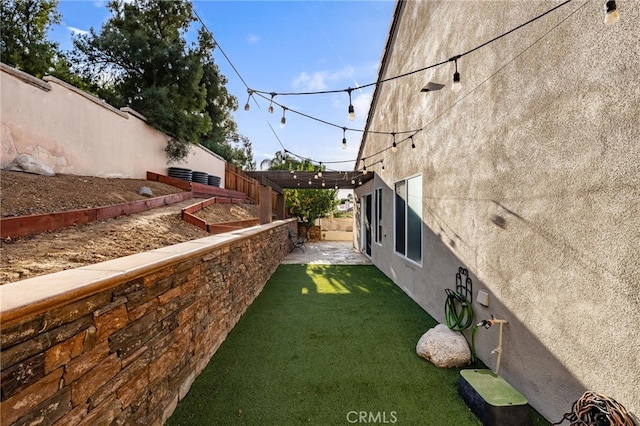 view of yard featuring a patio area and a fenced backyard